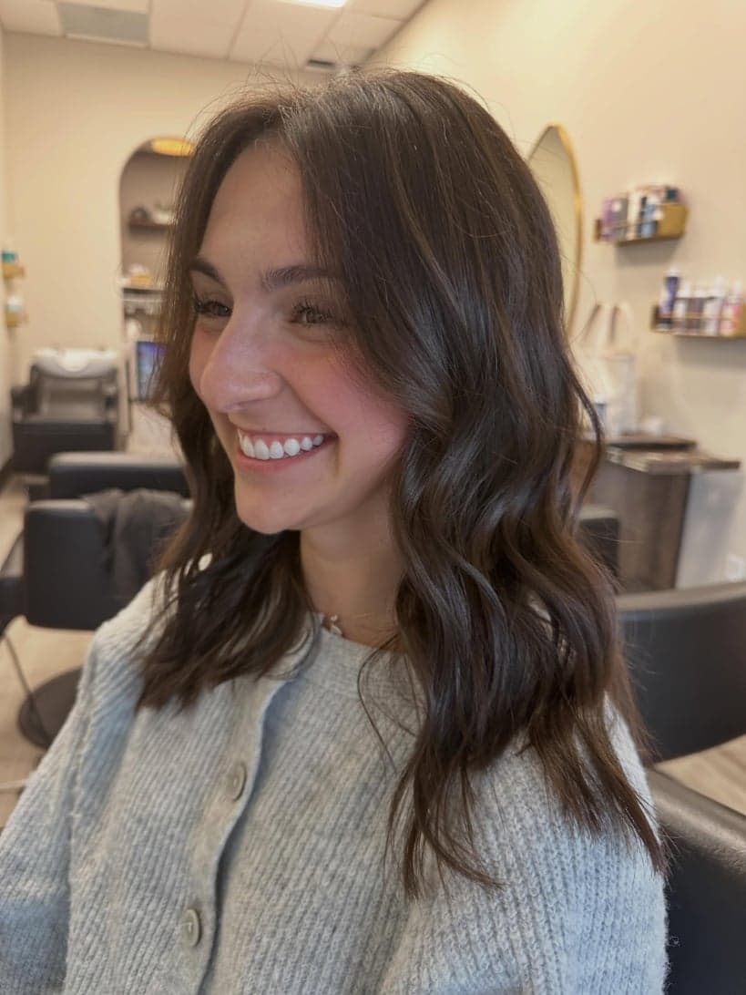 Big chop to a shoulder-length cut with soft face-framing layers in rich dark brunette — hair by Alchemy Loft