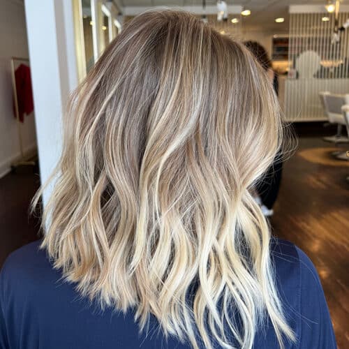 High-contrast blonde lob — hair by Alchemy Loft